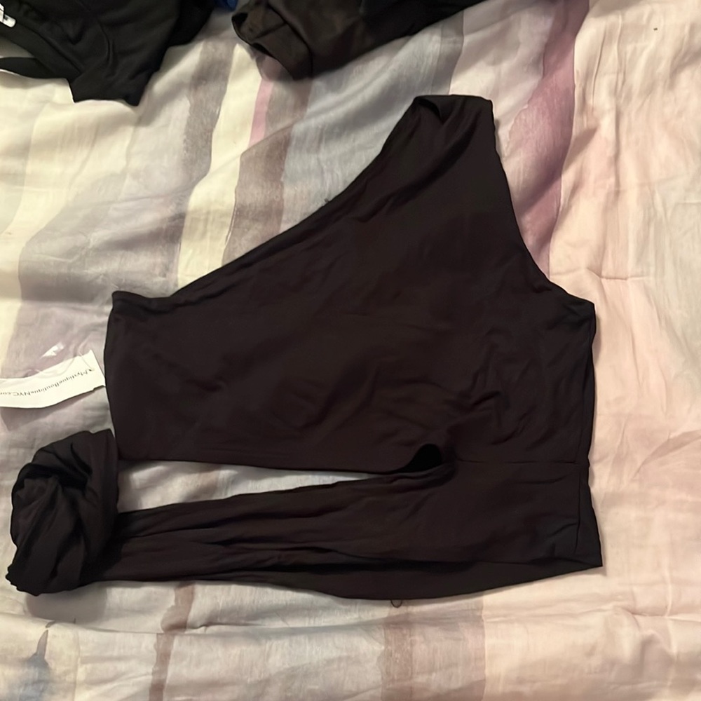 Black cropped one shoulder with tie in the front: Brand: Mystique Boutique